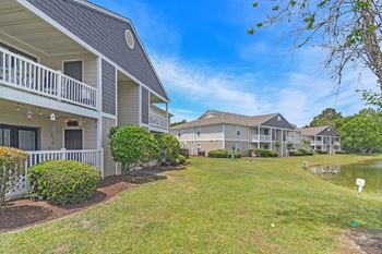 community with houses and a pondat The Pointe Apartment Homes, Gautier, Mississippi, 39553